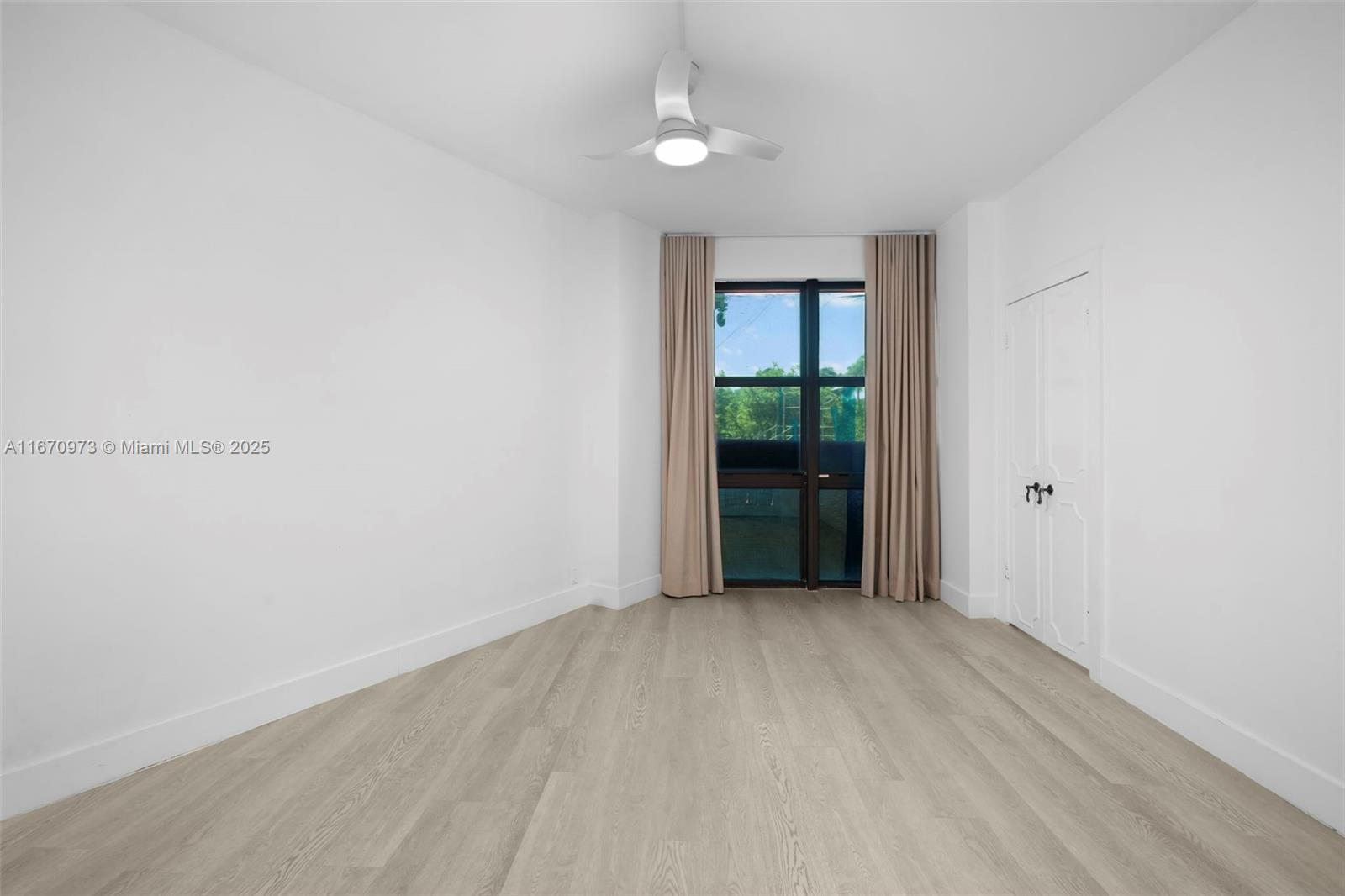 1121 Crandon Boulevard, Unit E105 Key Biscayne, FL 33149 - Photo 17 of 43 wooden floor in an empty room