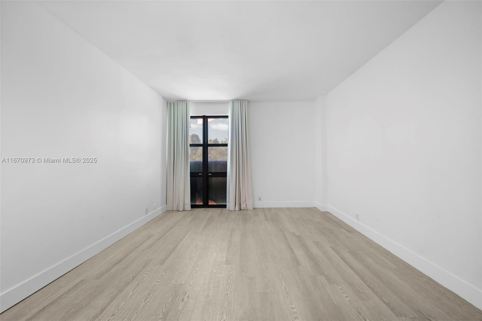 1121 Crandon Boulevard, Unit E105 Key Biscayne, FL 33149 - Photo 22 of 43 wooden floor in a empty room