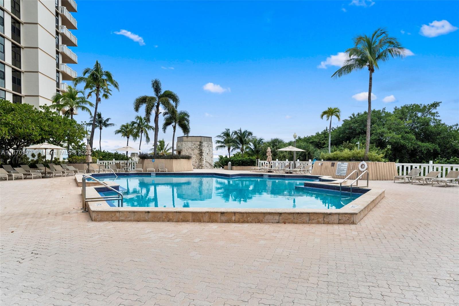 1121 Crandon Boulevard, Unit E105 Key Biscayne, FL 33149 - Photo 30 of 43 a view of swimming pool with a yard