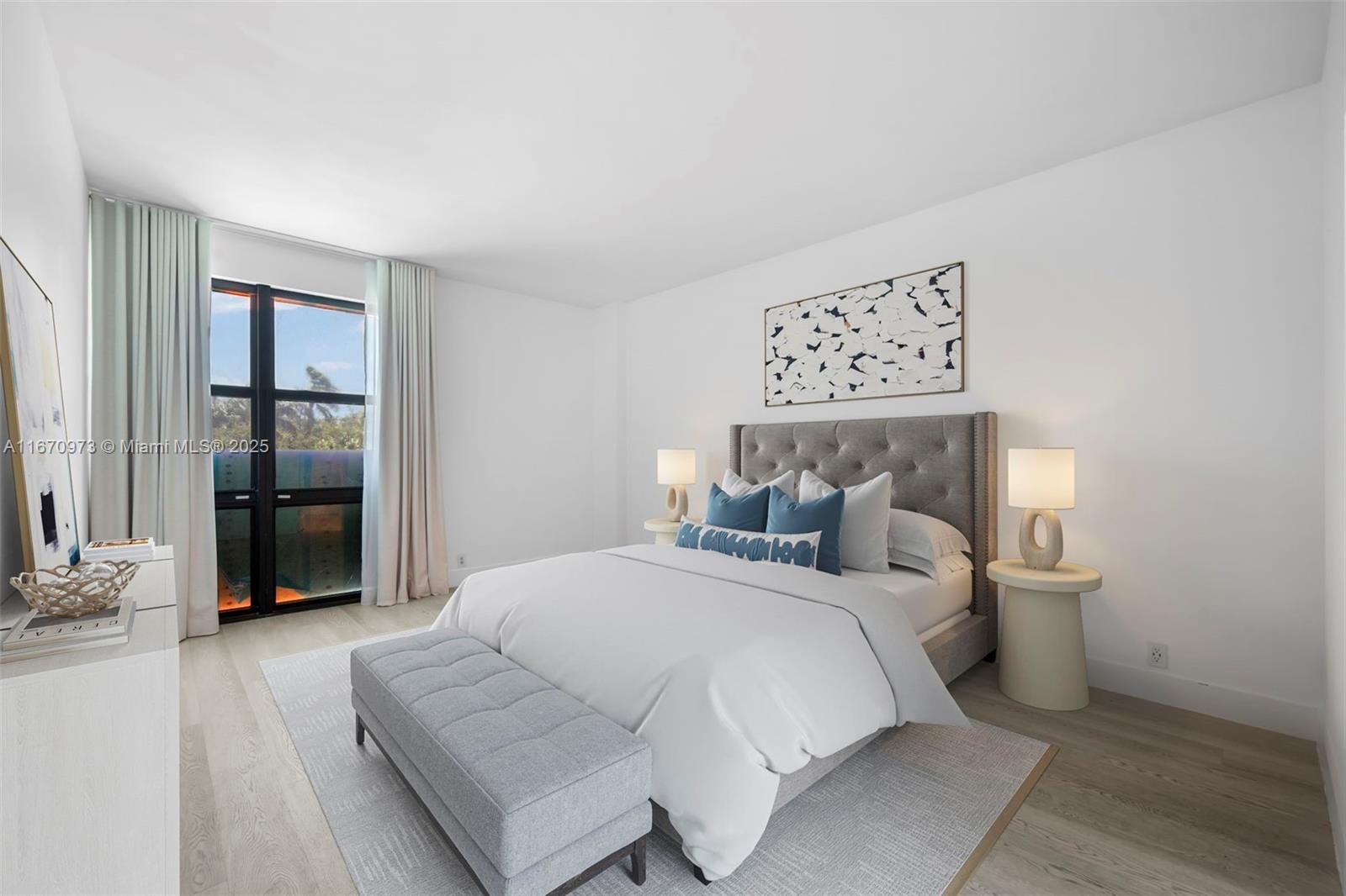 1121 Crandon Boulevard, Unit E105 Key Biscayne, FL 33149 - Photo 3 of 43 a bedroom with a bed and a large mirror