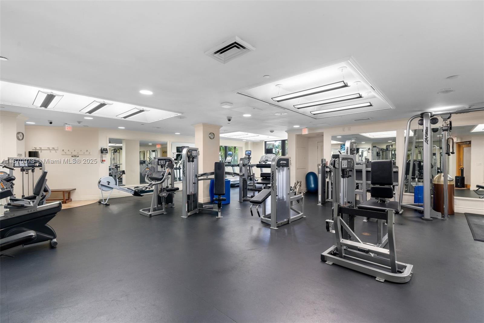 1121 Crandon Boulevard, Unit E105 Key Biscayne, FL 33149 - Photo 31 of 43 a view of a room with gym equipment
