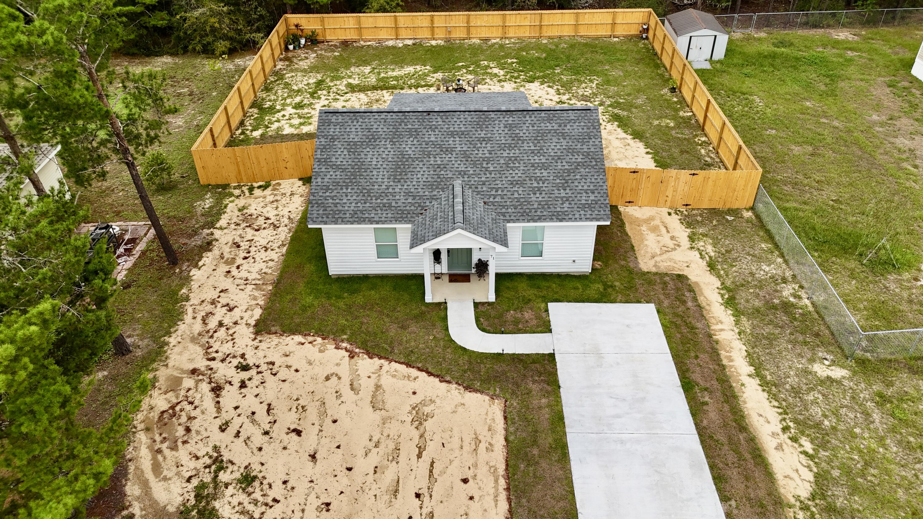 71 Lafavre Lane DeFuniak Springs, FL 32433 - Photo 1 of 32 swimming pool view with a garden