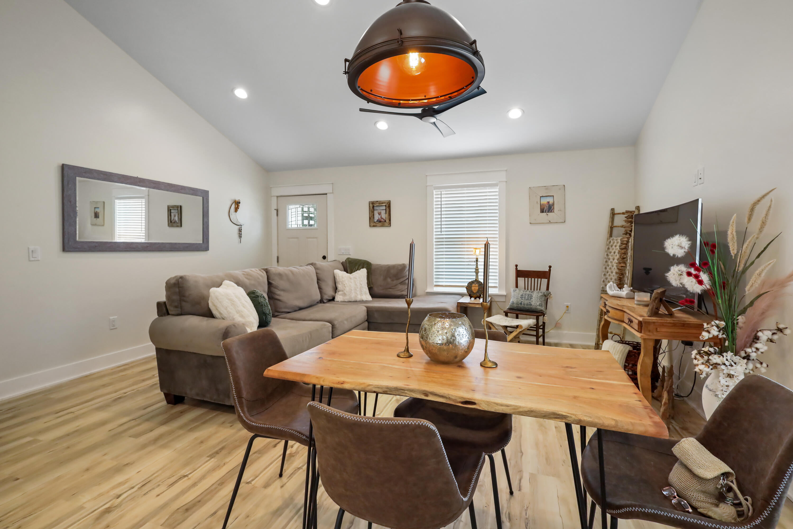 71 Lafavre Lane DeFuniak Springs, FL 32433 - Photo 14 of 32 a view of a dining room with furniture and wooden floor