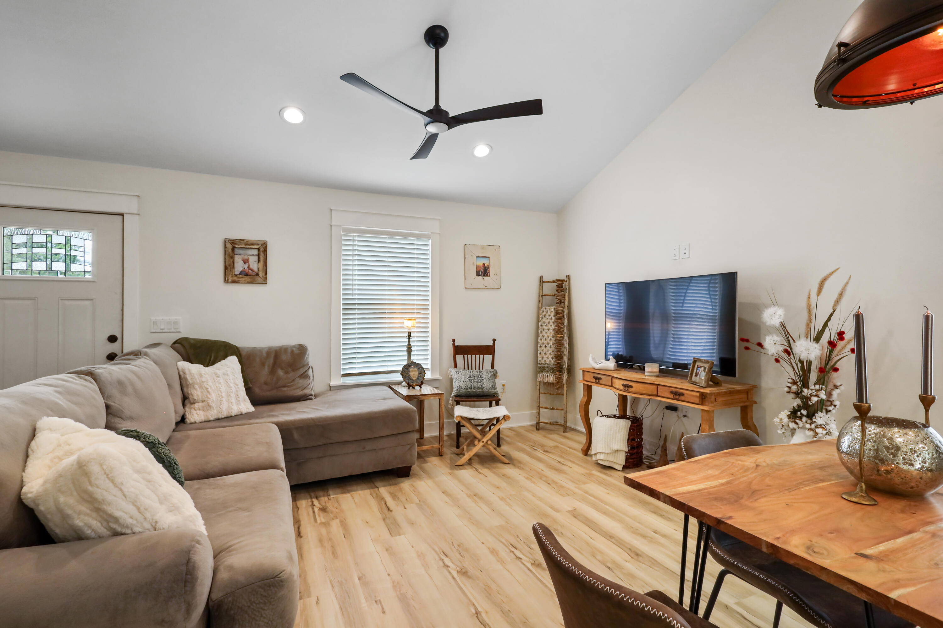 71 Lafavre Lane DeFuniak Springs, FL 32433 - Photo 15 of 32 a living room with furniture a flat screen tv and a window