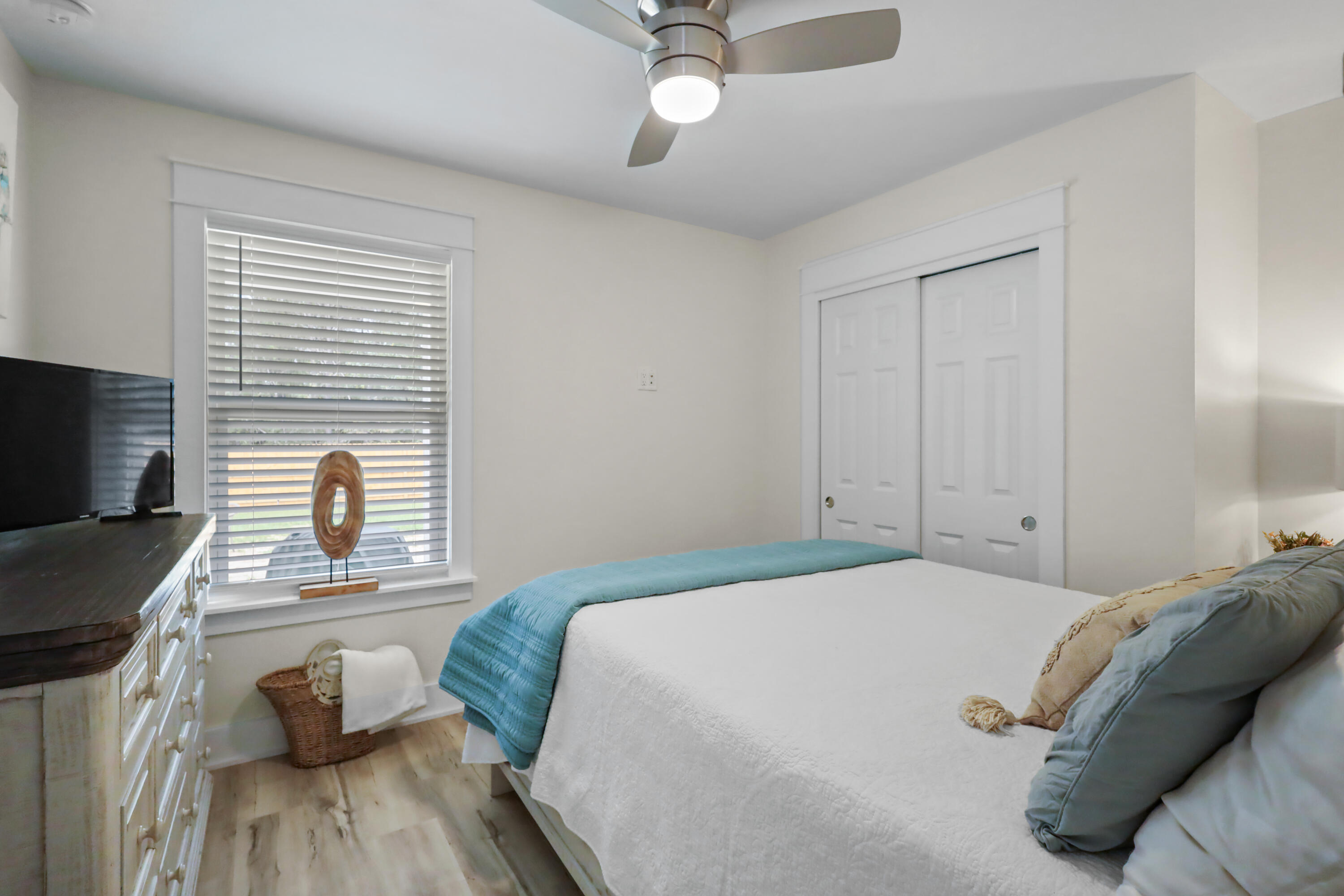 71 Lafavre Lane DeFuniak Springs, FL 32433 - Photo 20 of 32 a bedroom with a bed and a chandelier