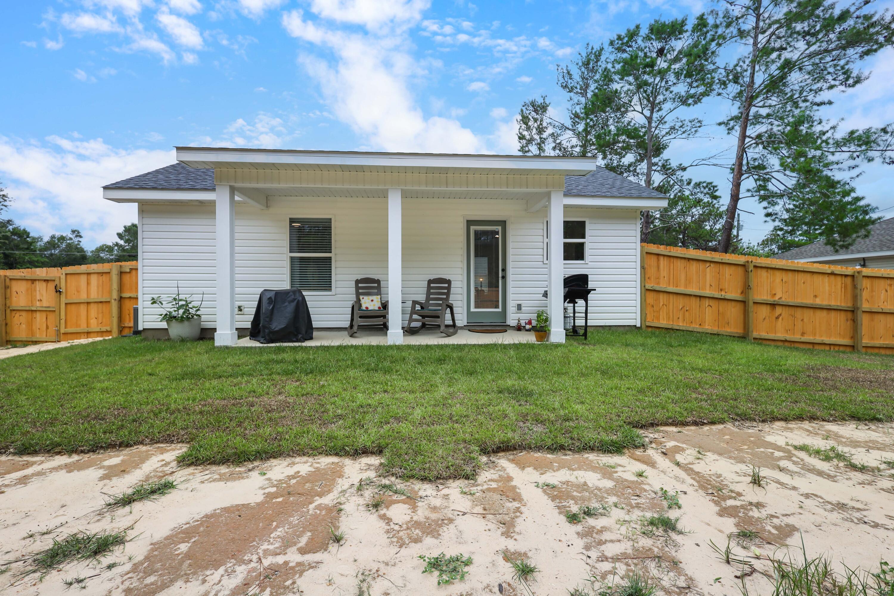 71 Lafavre Lane DeFuniak Springs, FL 32433 - Photo 23 of 32 a view of a house with a backyard
