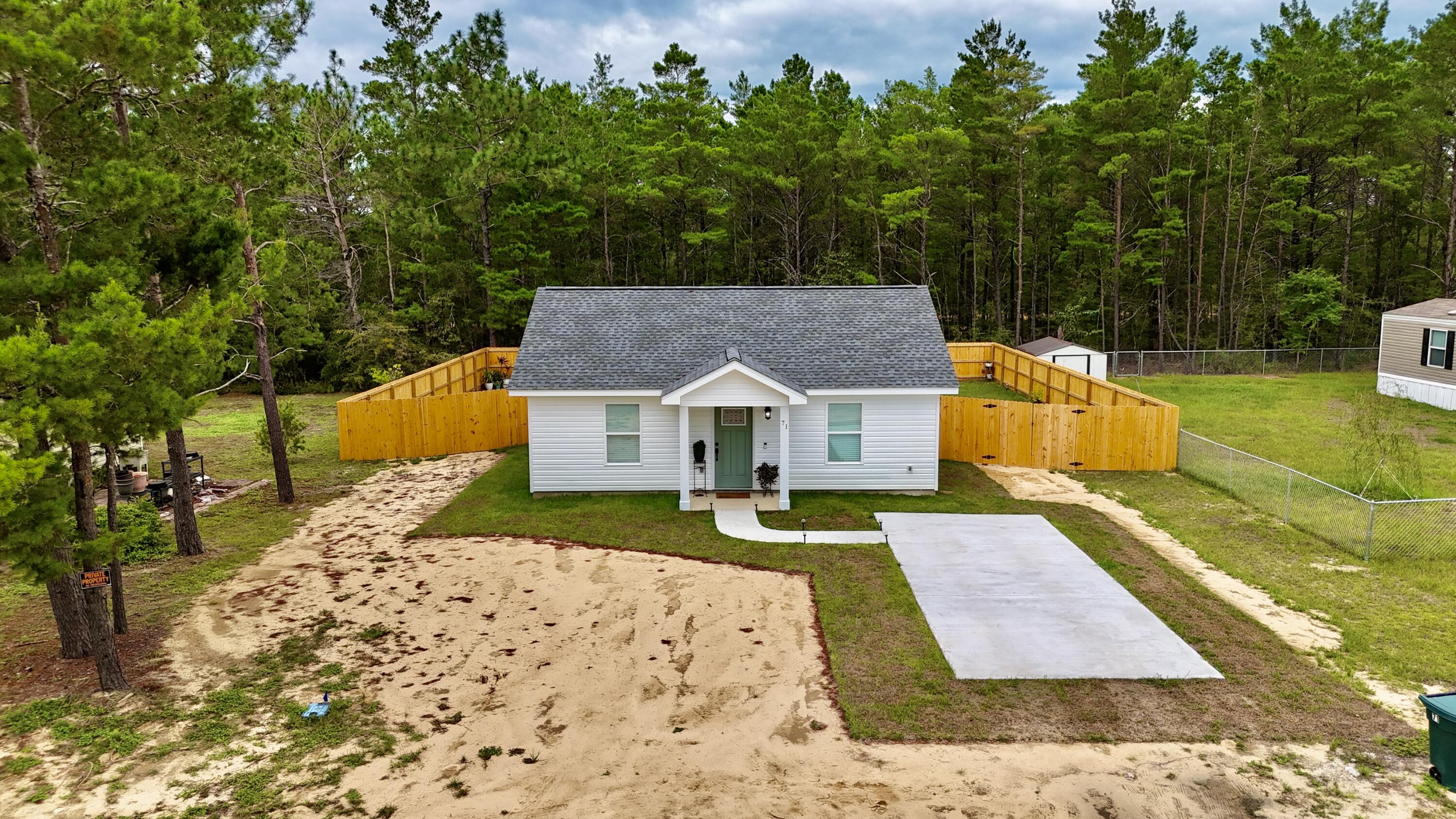 71 Lafavre Lane DeFuniak Springs, FL 32433 - Photo 26 of 32 swimming pool view with a garden