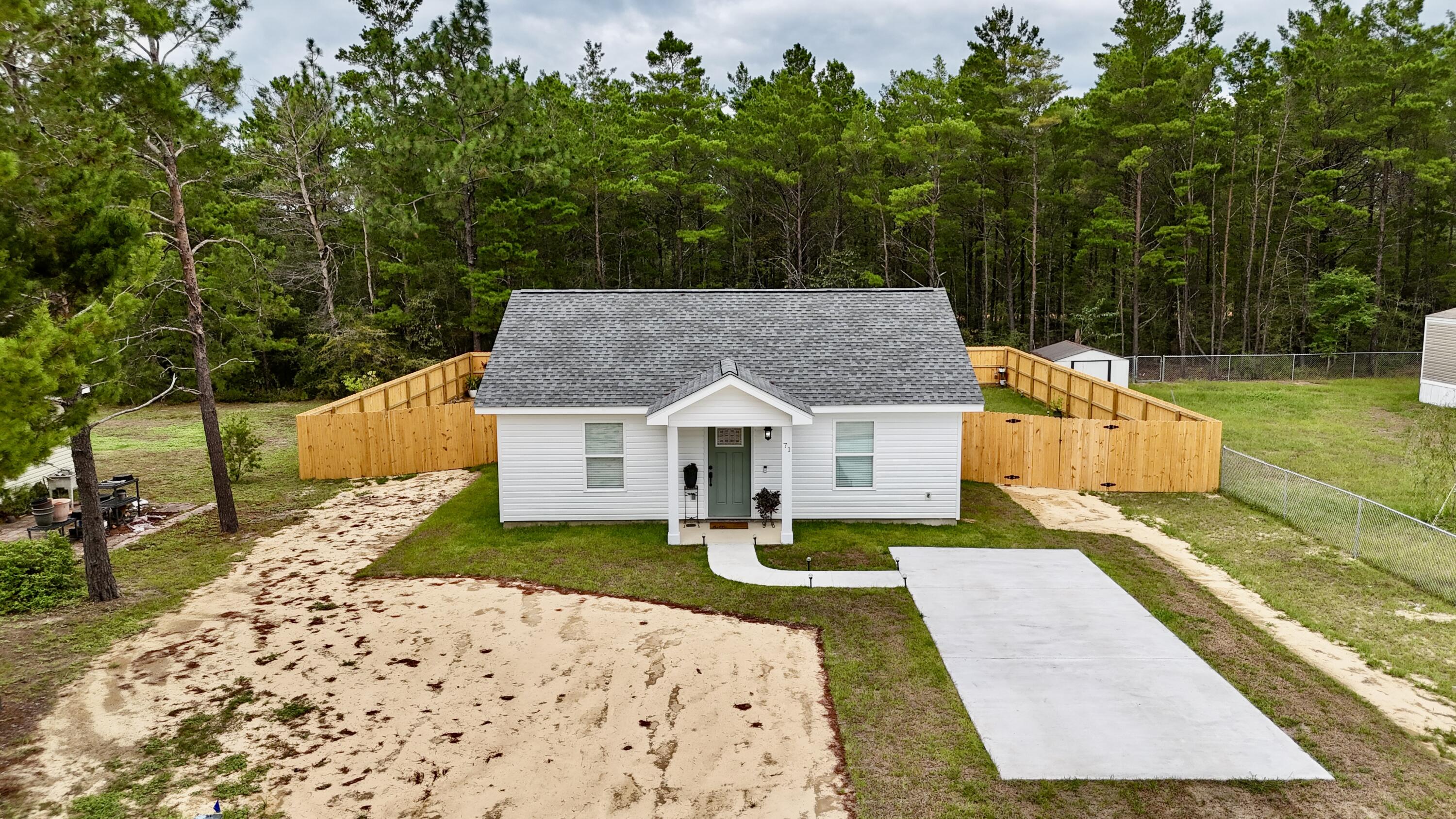 71 Lafavre Lane DeFuniak Springs, FL 32433 - Photo 28 of 32 front view of a house with a yard