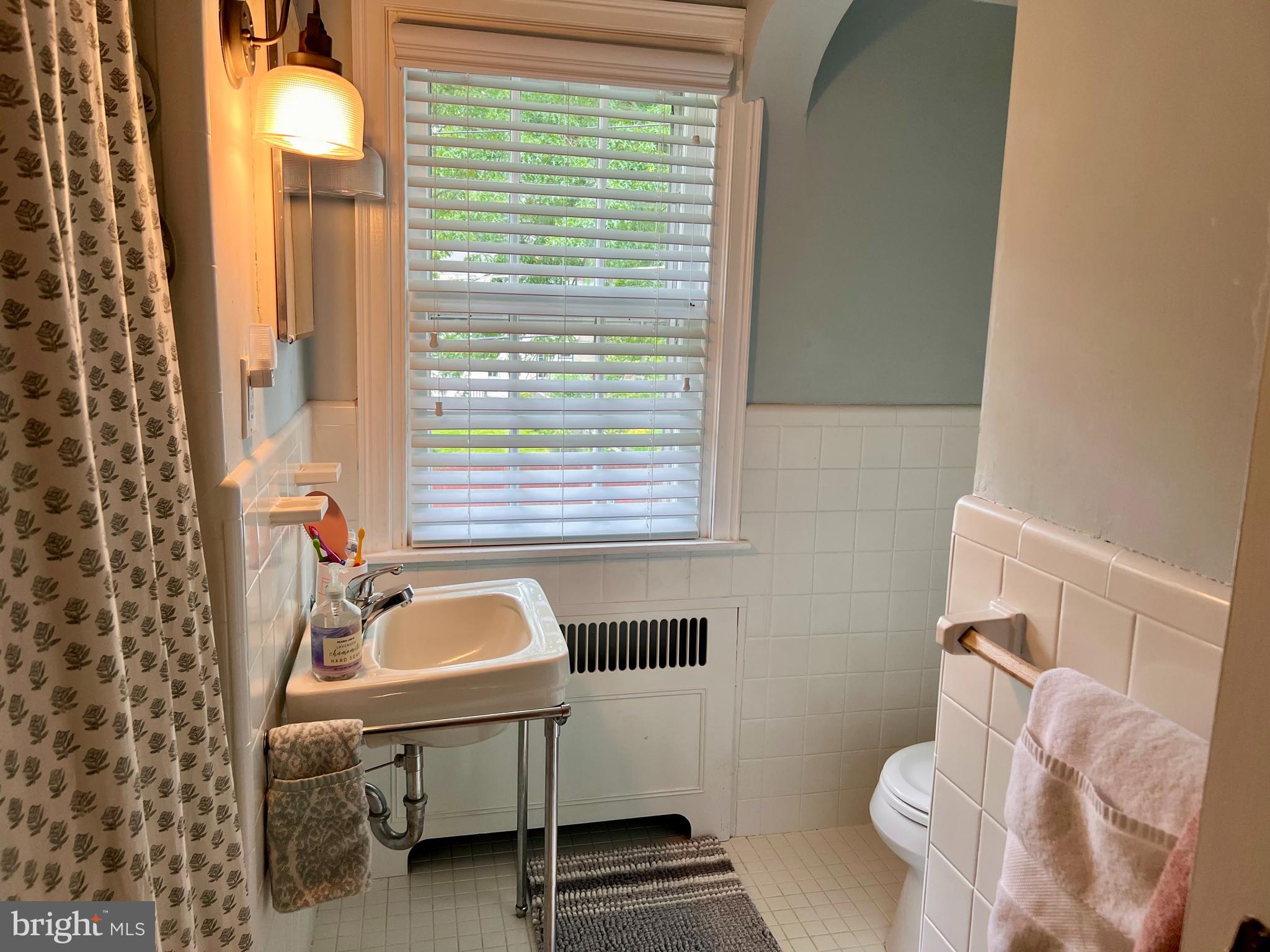 112 Hilltop Road Philadelphia, PA 19118 - Photo 12 of 13 a bathroom with a sink and a toilet