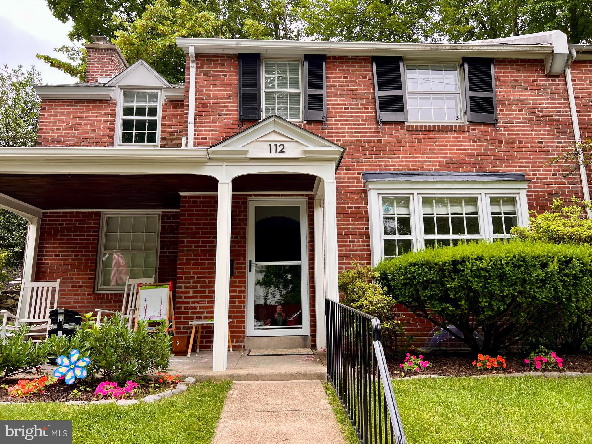 112 Hilltop Road Philadelphia, PA 19118 - Photo 2 of 13 a front view of a house with a yard