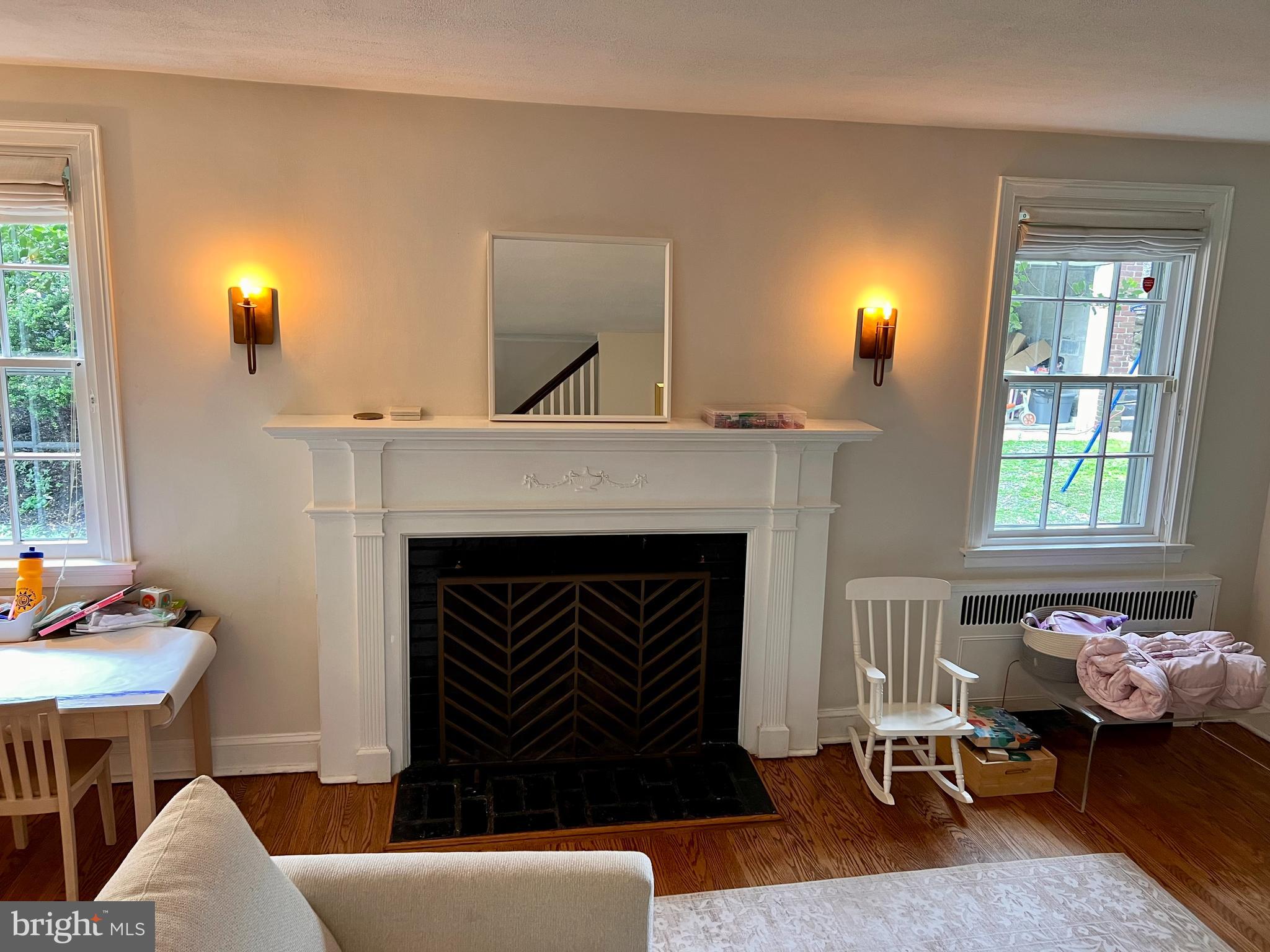 112 Hilltop Road Philadelphia, PA 19118 - Photo 4 of 13 a living room with furniture and a fireplace
