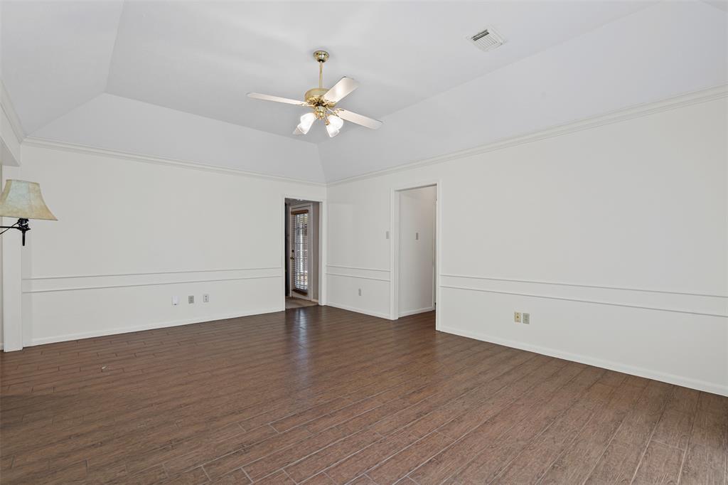 7948 Morning Lane Fort Worth, TX 76123 - Photo 12 of 32 an empty room with wooden floor fan and windows