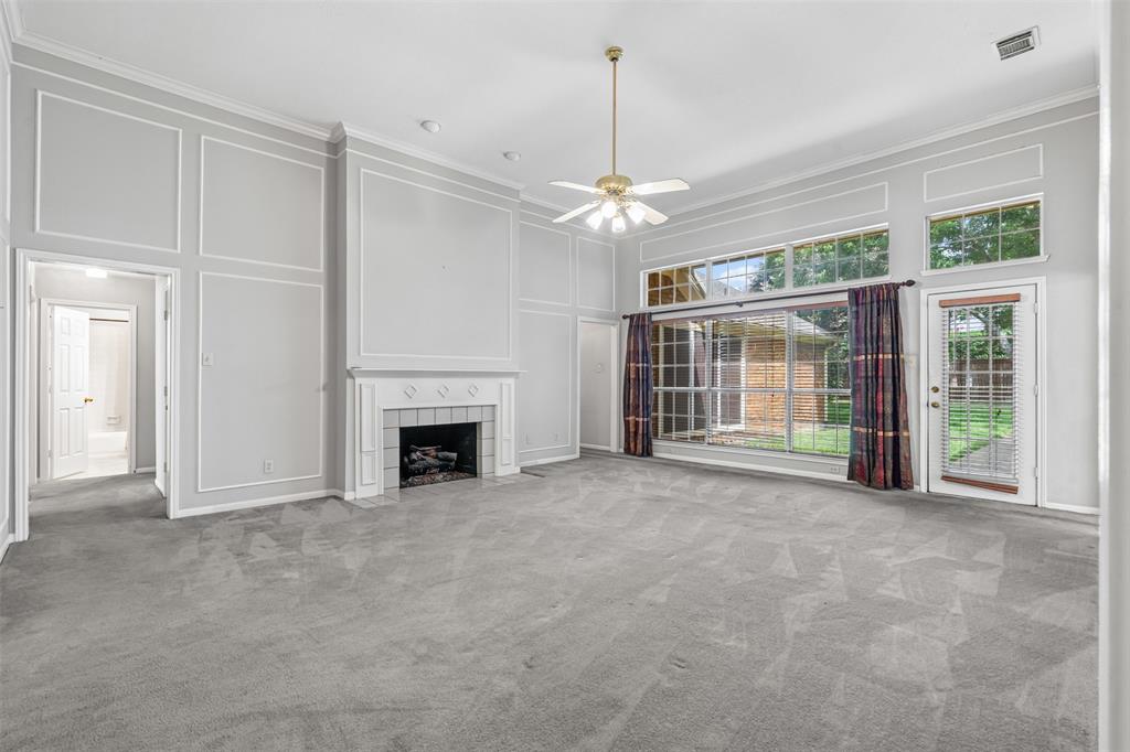 7948 Morning Lane Fort Worth, TX 76123 - Photo 17 of 32 a view of a livingroom with an empty space and a fireplace