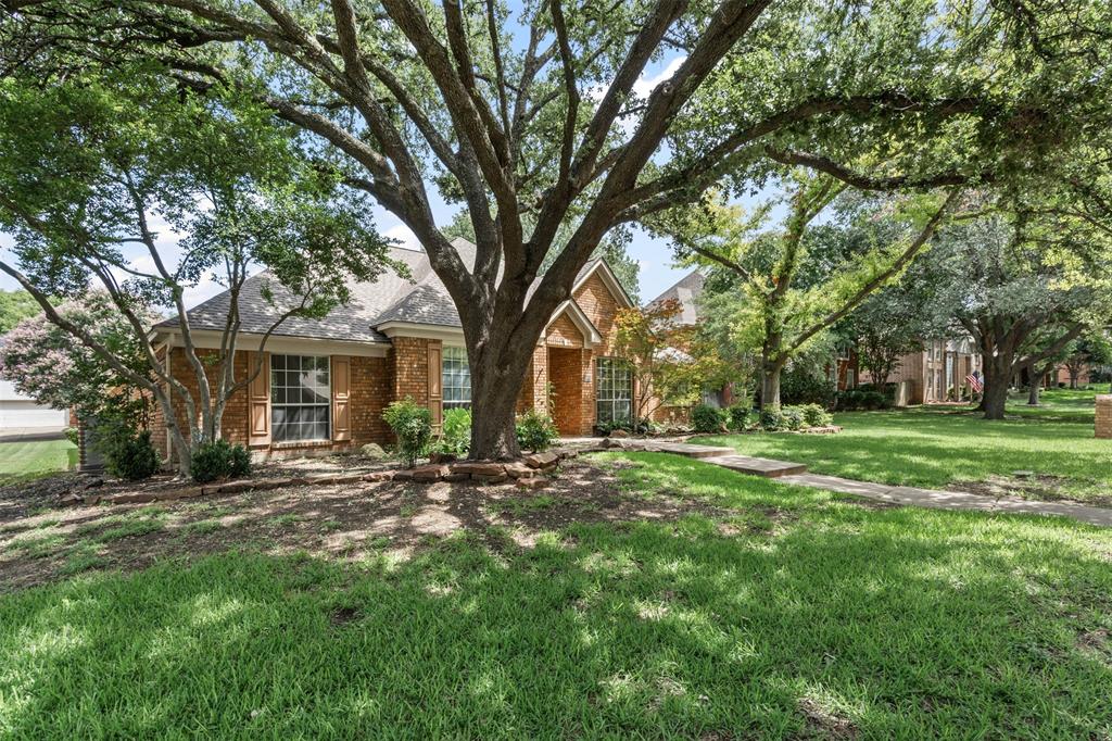 7948 Morning Lane Fort Worth, TX 76123 - Photo 2 of 32 a view of a house with a large tree and a big yard