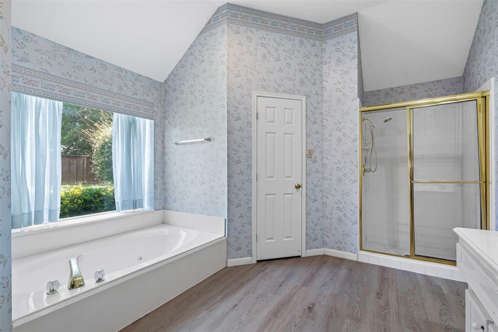 7948 Morning Lane Fort Worth, TX 76123 - Photo 24 of 32 a bathroom with a bathtub and a shower