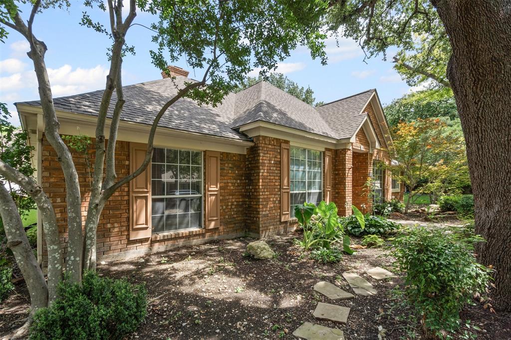 7948 Morning Lane Fort Worth, TX 76123 - Photo 6 of 32 front view of a house with a garden