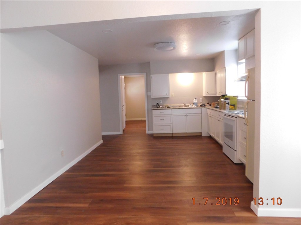 2625 Riggan Street Corpus Christi, TX 78404 - Photo 2 of 7 a large kitchen with hardwood floor and a sink