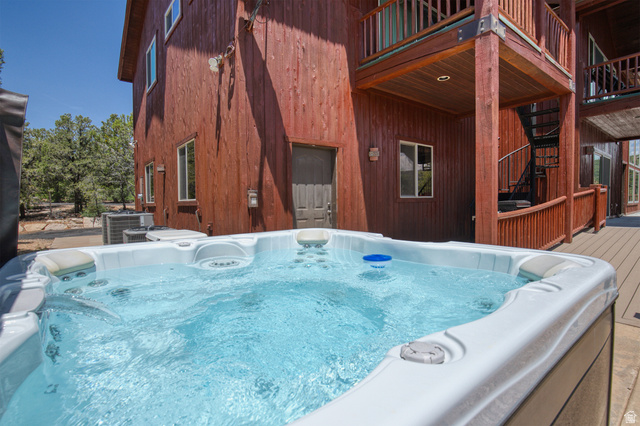 755 South Zion Ridge Drive Orderville, UT 84758 - Photo 18 of 84 View of swimming pool featuring a hot tub and a deck