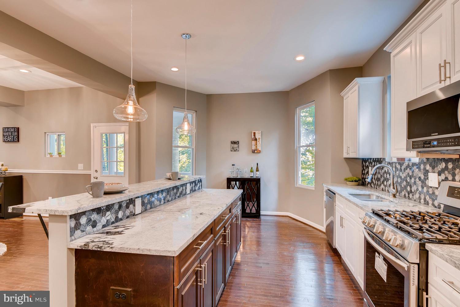 2612 Talbot Road Baltimore, MD 21216 - Photo 8 of 33 a large kitchen with a stove and a sink