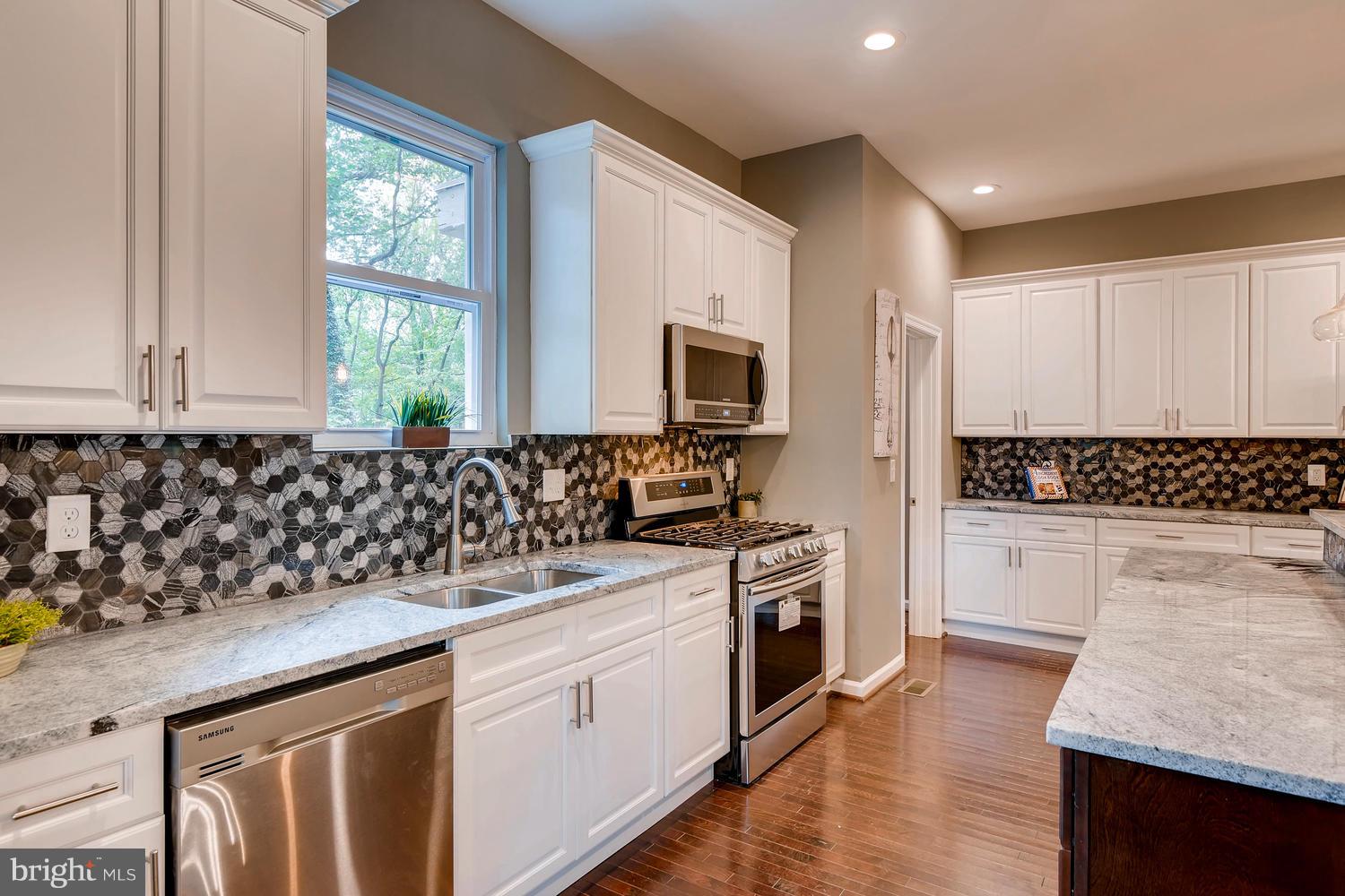 2612 Talbot Road Baltimore, MD 21216 - Photo 10 of 33 a kitchen with a sink stove and microwave