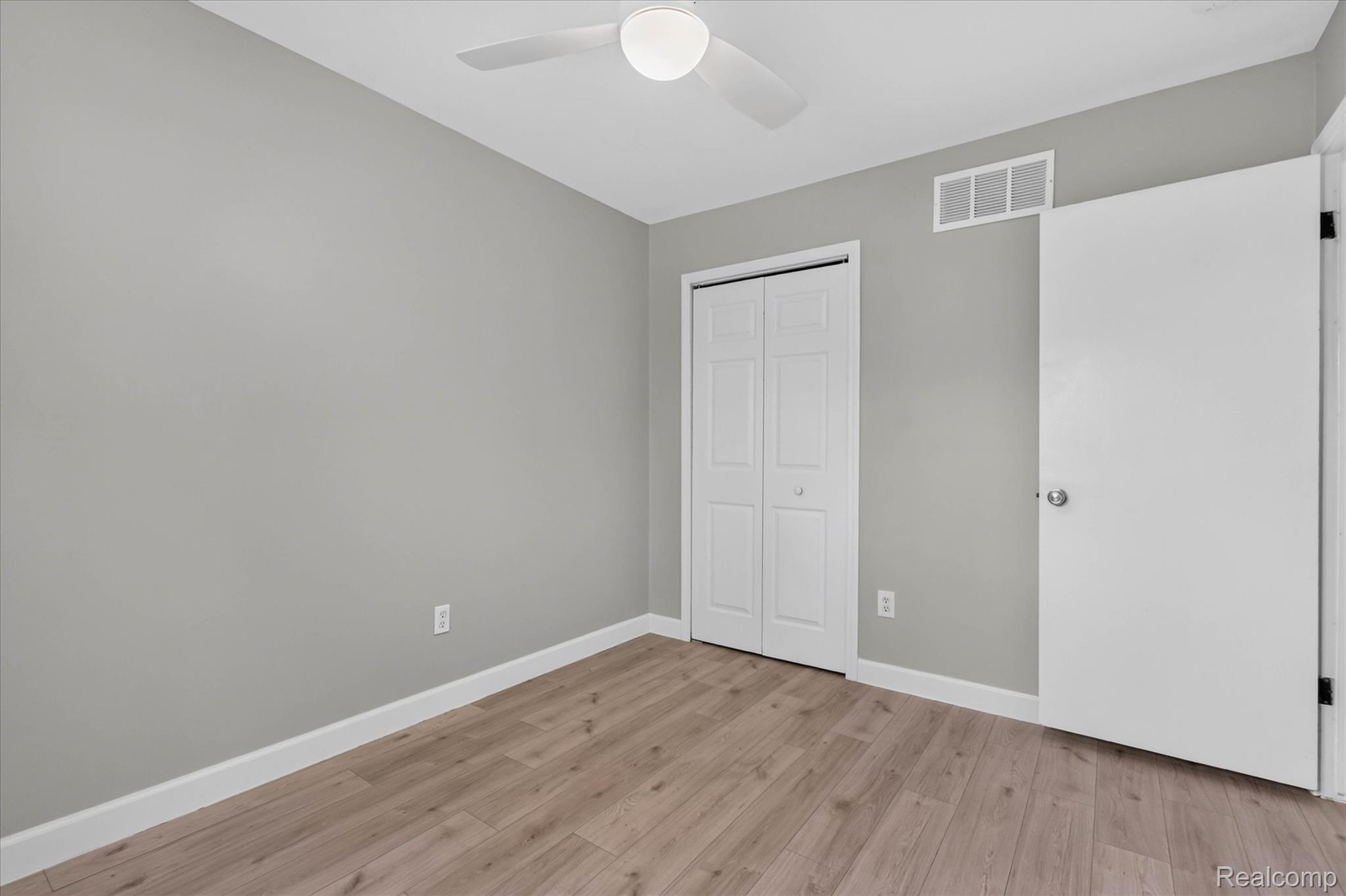 934 Harvard Road Berkley, MI 48072 - Photo 25 of 34 Room featuring wood-finish flooring, light gray wall paint, and white baseboards