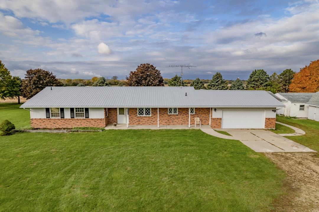 5618 North Armour Road Stillman Valley, IL 61084 - Photo 1 of 29 an aerial view of residential houses with outdoor space and trees