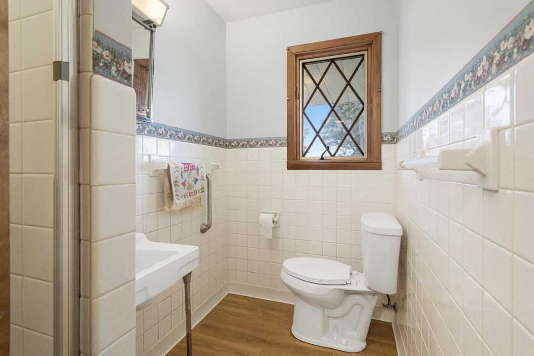 5618 North Armour Road Stillman Valley, IL 61084 - Photo 13 of 29 a bathroom with a toilet sink and shower