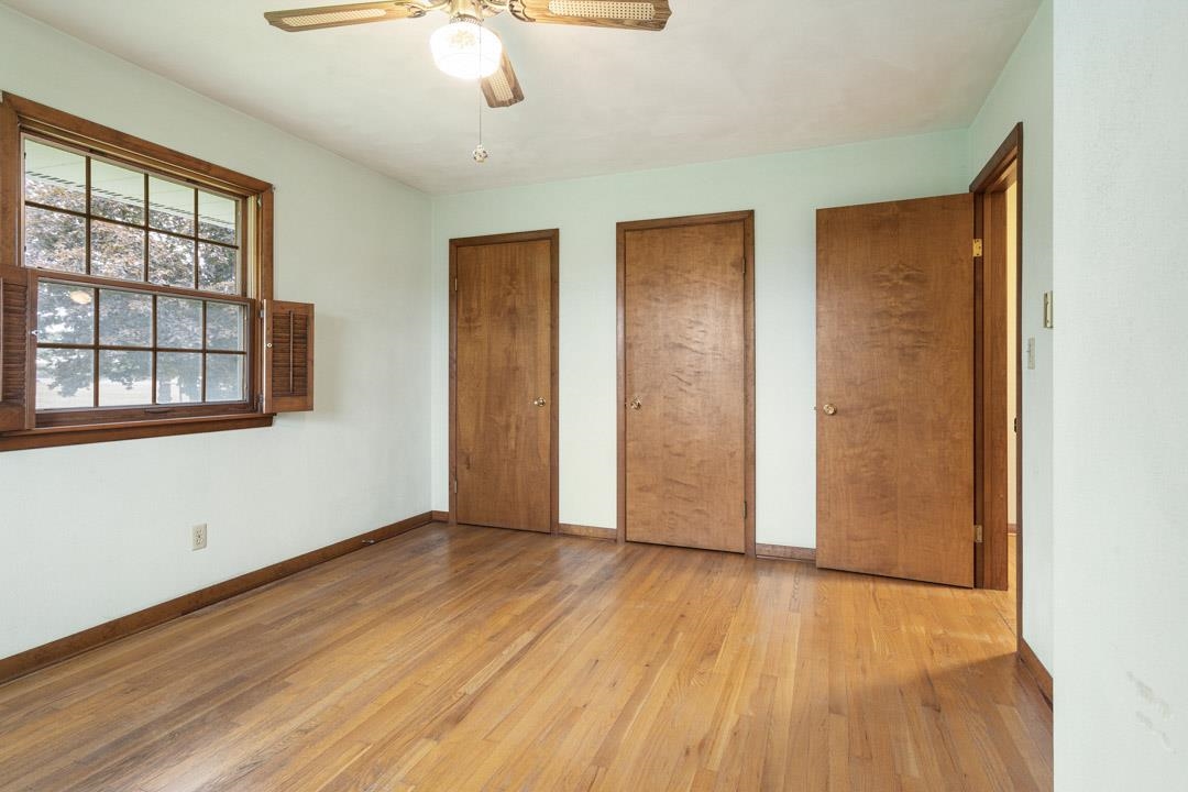 5618 North Armour Road Stillman Valley, IL 61084 - Photo 18 of 29 a view of an empty room with wooden floor and a window