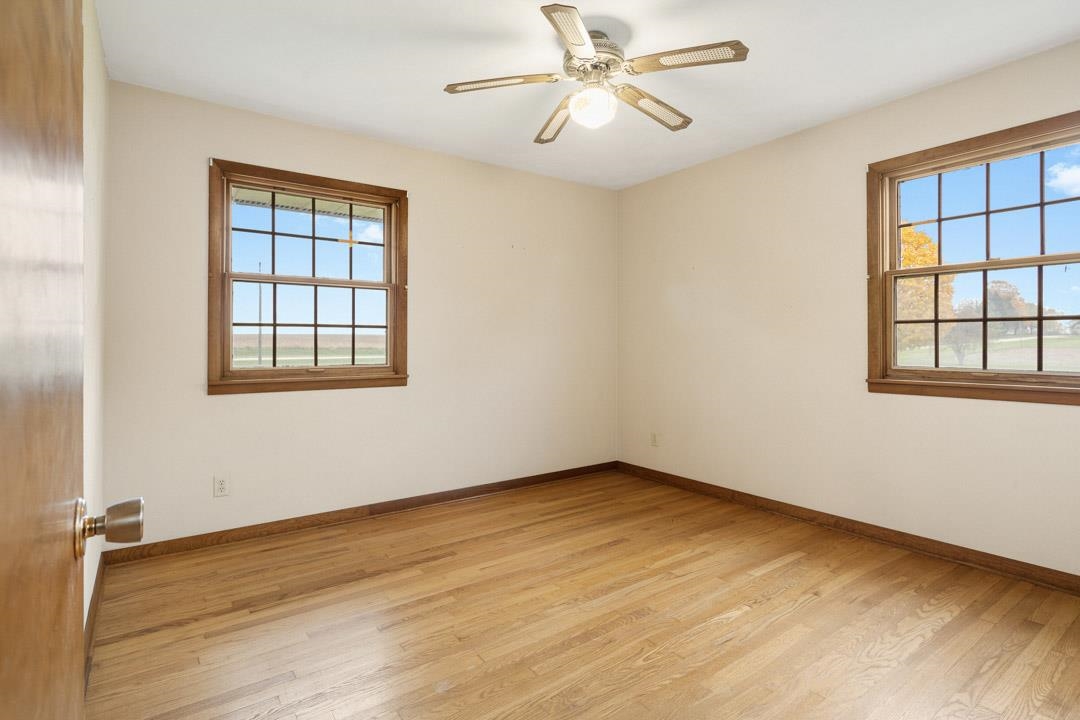 5618 North Armour Road Stillman Valley, IL 61084 - Photo 20 of 29 a view of empty room with wooden floor and fan