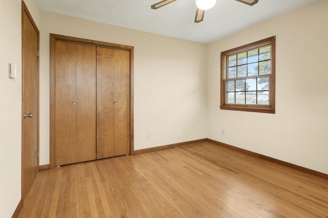 5618 North Armour Road Stillman Valley, IL 61084 - Photo 23 of 29 a view of an empty room with window and wooden floor