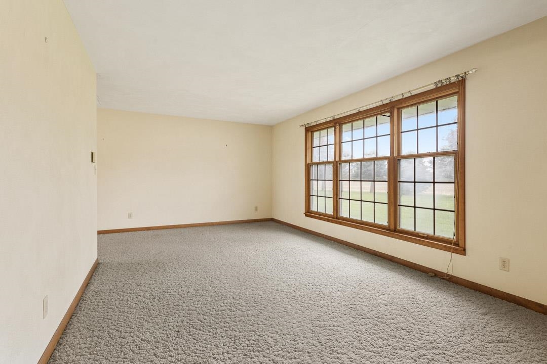 5618 North Armour Road Stillman Valley, IL 61084 - Photo 6 of 29 wooden floor in an empty room with a window
