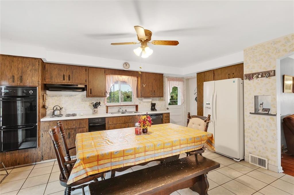 117 Diebold Road McKees Rocks, PA 15136 - Photo 13 of 22 a room with stainless steel appliances a refrigerator and a refrigerator