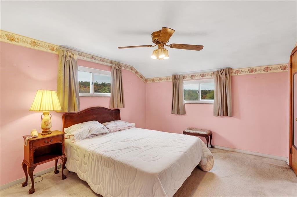 117 Diebold Road McKees Rocks, PA 15136 - Photo 15 of 22 a bedroom with a bed and a window