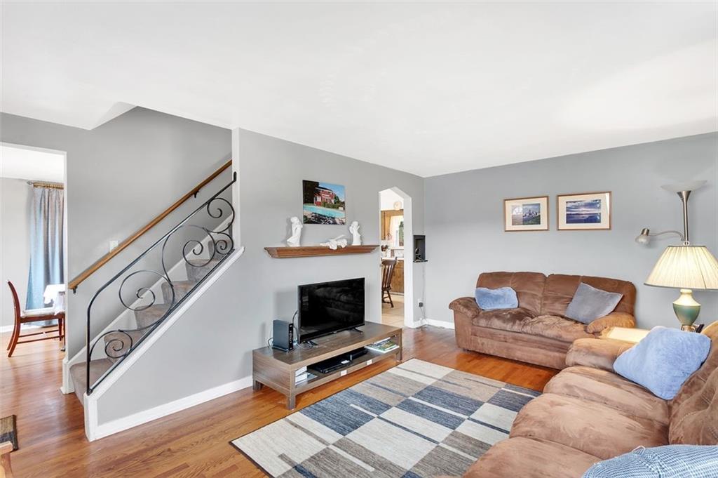 117 Diebold Road McKees Rocks, PA 15136 - Photo 9 of 22 a living room with furniture a fireplace and a flat screen tv