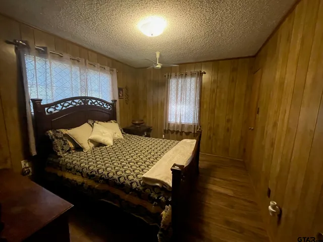 a bedroom with a bed and a table