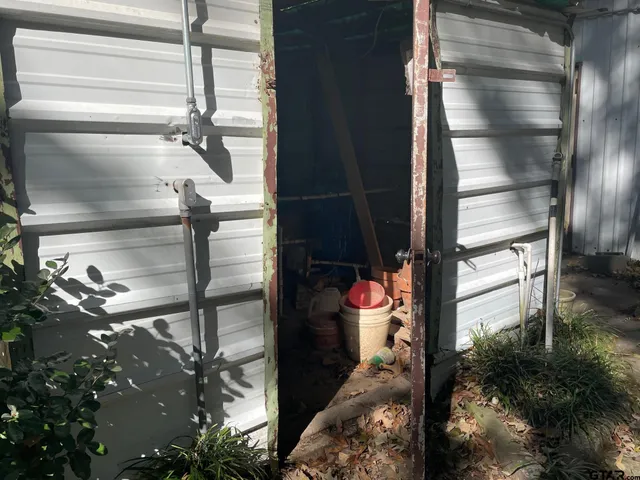 a view of a yard with trees