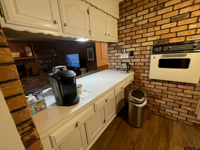 a kitchen with a sink and cabinets