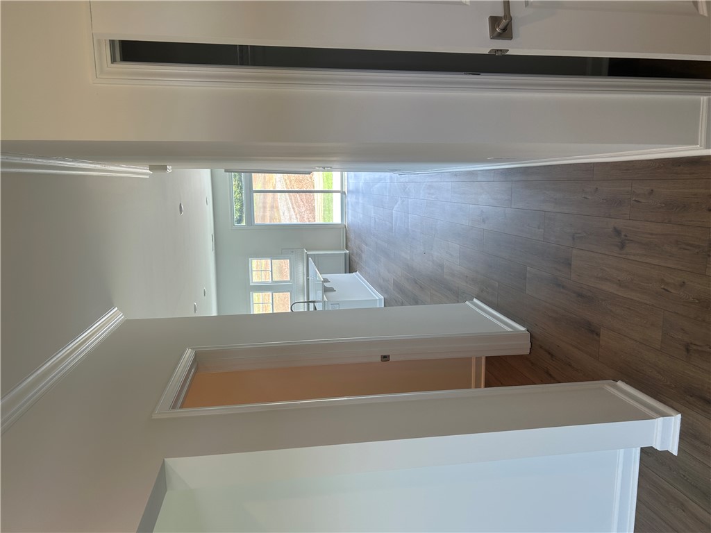 211 Bellflower Lane Anderson, SC 29625 - Photo 5 of 28 Long sight lines and warm wood floors define this open-concept interior space.