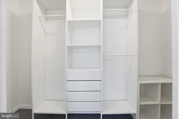 a view of an empty walk in closet