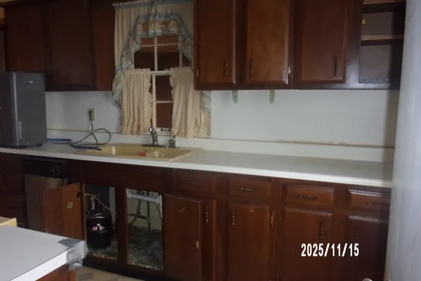 a kitchen with a sink and cabinets