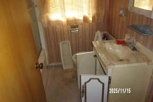 a bathroom with a sink and shower