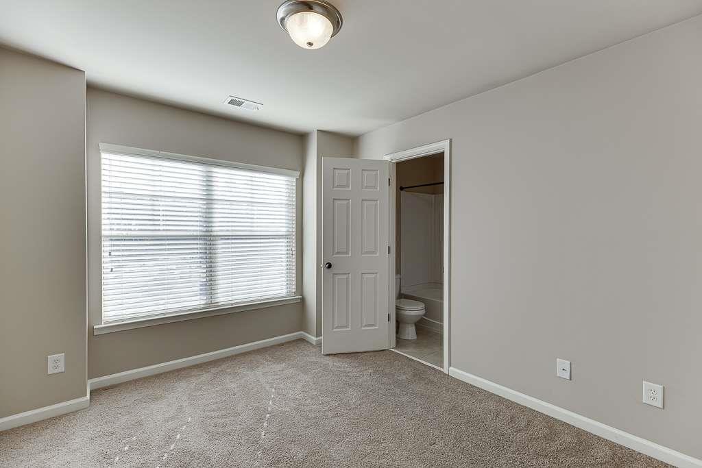 1043 Nightfall Court Northwest Suwanee, GA 30024 - Photo 19 of 39 a view of an empty room with a window