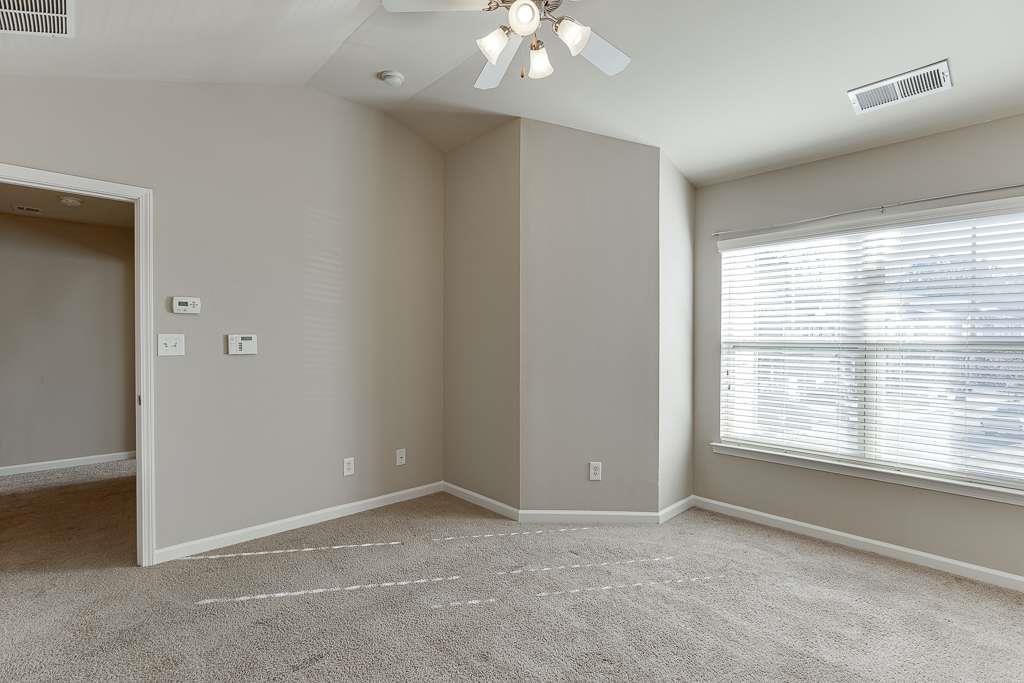 1043 Nightfall Court Northwest Suwanee, GA 30024 - Photo 25 of 39 a view of an empty room with a window