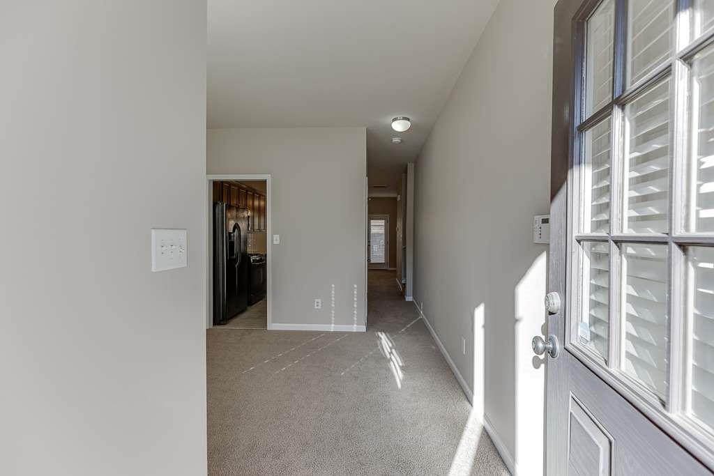 1043 Nightfall Court Northwest Suwanee, GA 30024 - Photo 4 of 39 a view of an empty room with a window