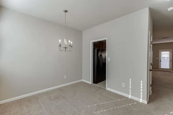 a view of an empty room with a fan