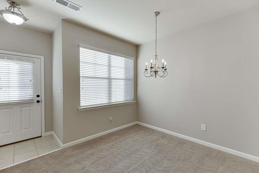 1043 Nightfall Court Northwest Suwanee, GA 30024 - Photo 6 of 39 a view of a room with windows
