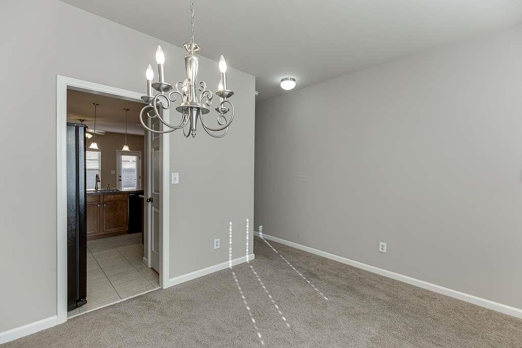 1043 Nightfall Court Northwest Suwanee, GA 30024 - Photo 7 of 39 en view interior of a house and chandelier