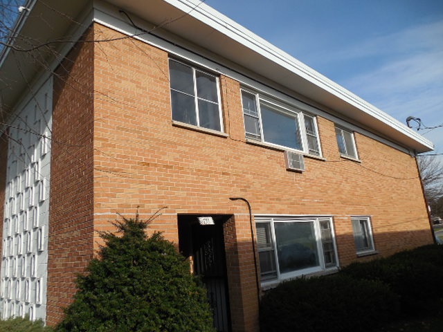 239 Northway Park Road, Unit 12 Machesney Park, IL 61115 - Photo 1 of 18 a front view of a house with plants