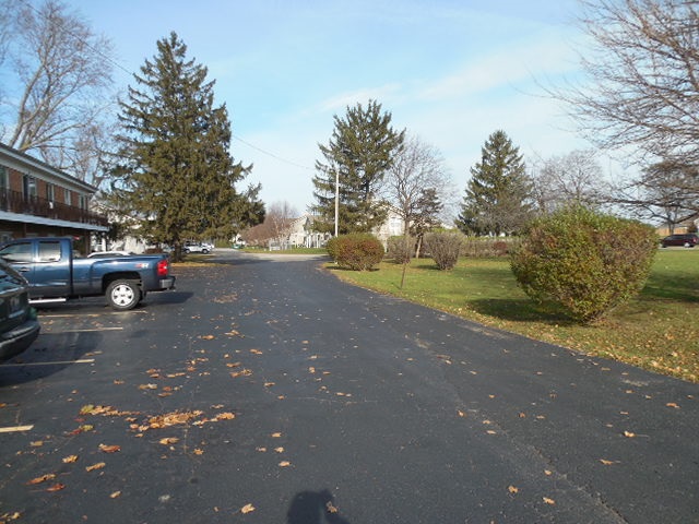 239 Northway Park Road, Unit 12 Machesney Park, IL 61115 - Photo 18 of 18 a view of street with parked cars