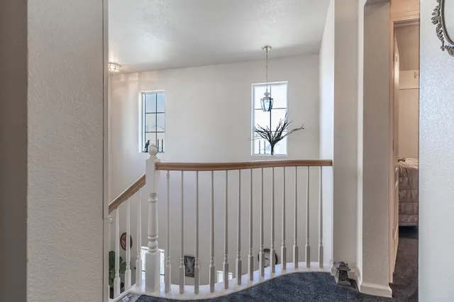 a view of a hallway with windows